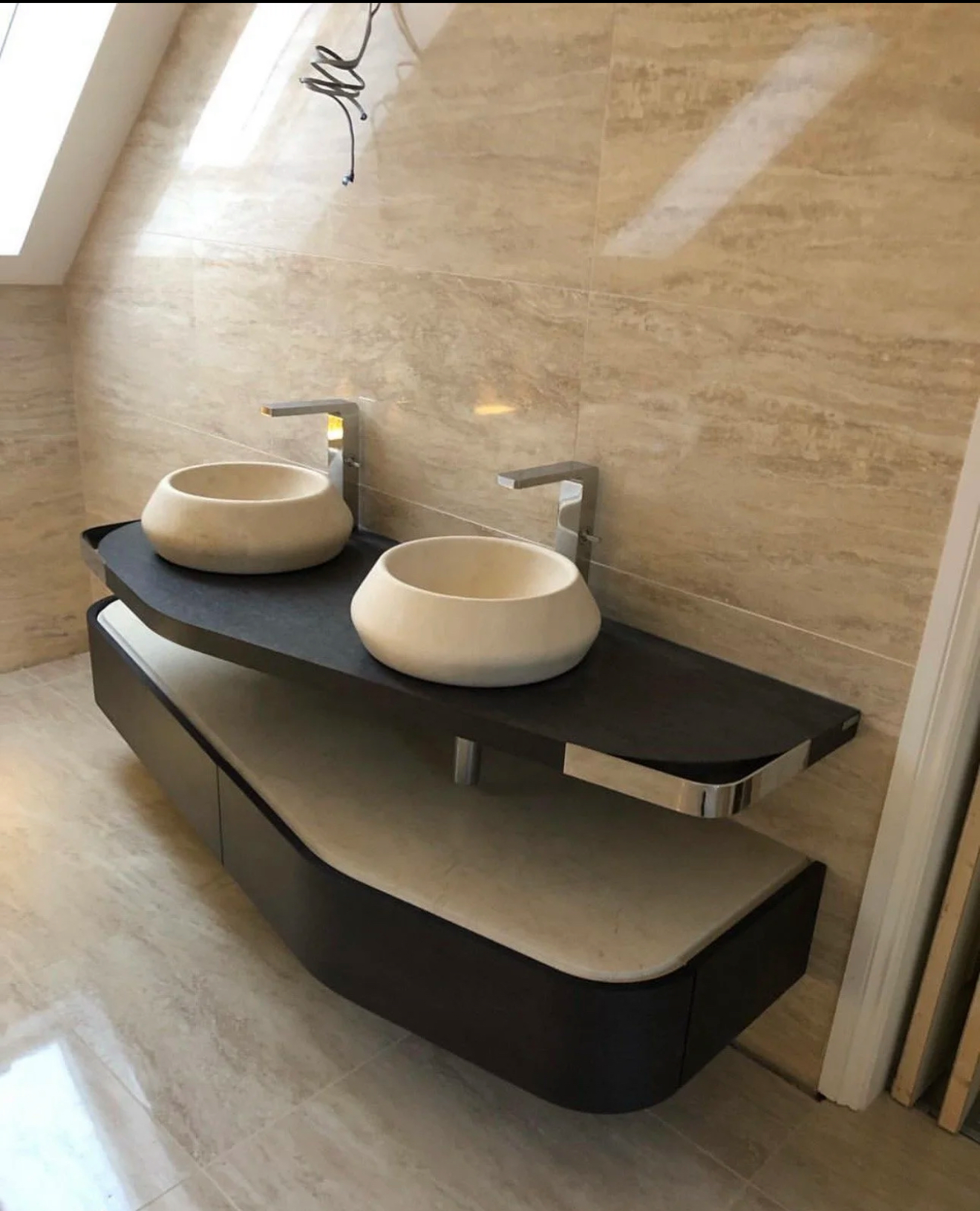 Luxury double stone vessel basins on a curved floating vanity
